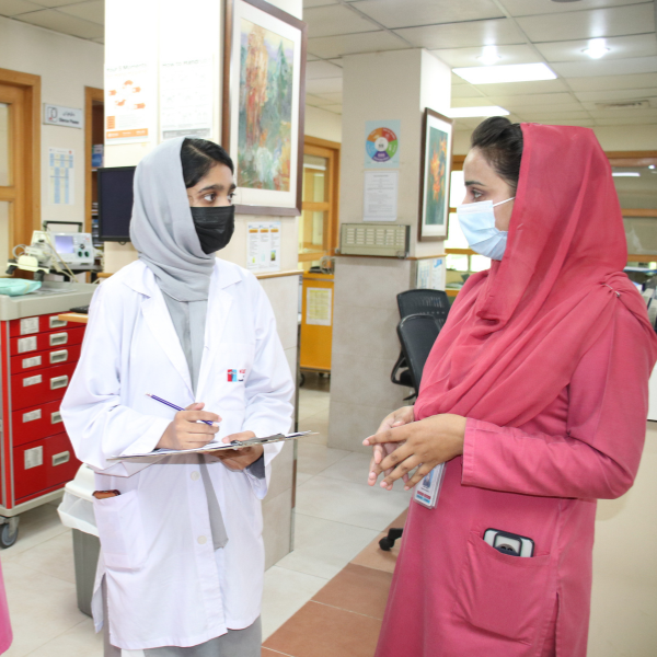 Experienced Nurse mentoring a student nurse during clinical rounds